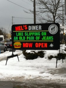 A sign on University Ave. announcing the return of Mel's. (Photo by Justin Fauteux). 
